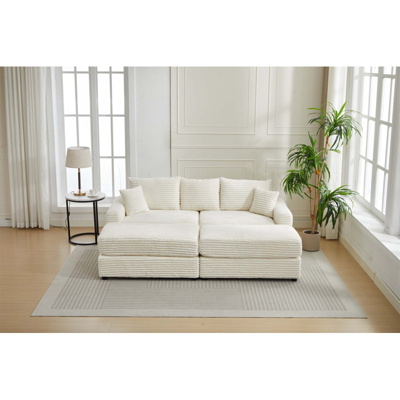 Canapé modulaire en velours côtelé avec housses extensibles et deux coussins, idéal pour rehausser le confort et le style de la maison