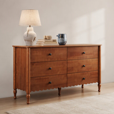 Commode polyvalente à six tiroirs en bois avec glissières lisses et détails élégants pour les espaces de vie organisés