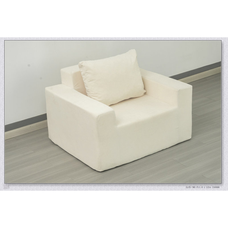Canapé confortable en mousse haute densité dans une boîte avec coussin, parfait pour la détente et les sièges polyvalents