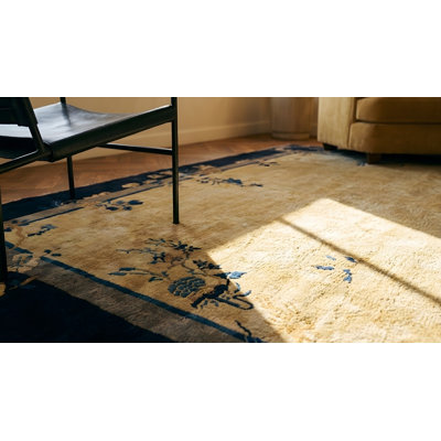 Tapis crème / antique en laine noire, ivoire et beige / blanc