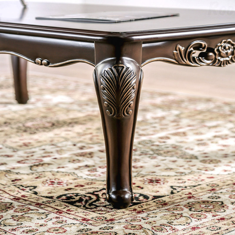 Table basse de style traditionnel avec pieds courbés et structure sculptée en bois massif Java, Brun