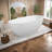 65" Matte White Freestanding Stone Resin Bathtub, 57.63 Gallons Capacity, Ergonomic Design With Center Drain, Overflow, Easy Maintenance,Pre-Installed Drain