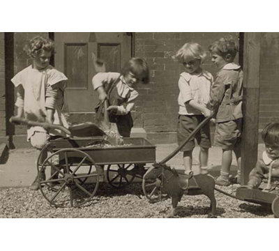 " Children Load Stones In Wagon With Shovel "