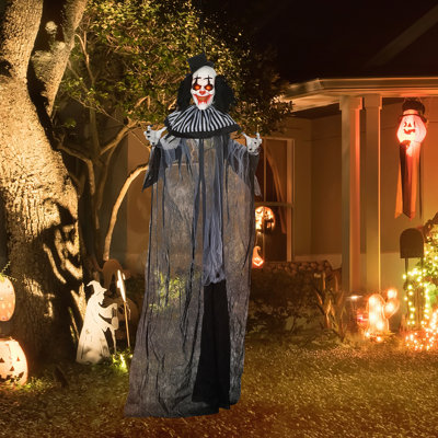 Décoration de clown d'Halloween grandeur nature avec son et mouvement, accessoire animé avec des yeux illuminés pour une atmosphère effrayante