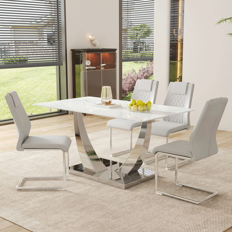 Ensemble de table et de chaises, table de salle à manger rectangulaire simple en verre moderne, plateau de table en verre marbré blanc de 0,4 pouce d'épaisseur, assorti à des chaises en polyuréthane de haute qualité avec des pieds en métal arqués.