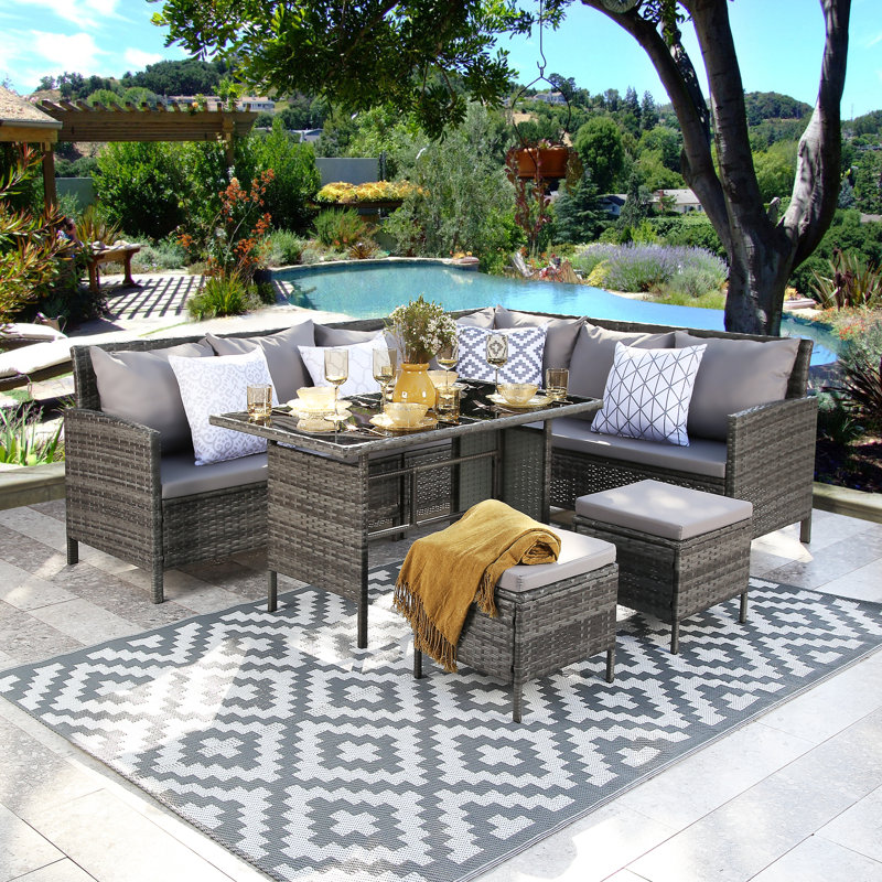 Aderinola Rattan Wicker 9 - Person Seating Group with Cushions
