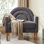 Chaise d'appoint rembourrée en lin avec dossier d'inspiration arc-en-ciel et pieds en bois, gris