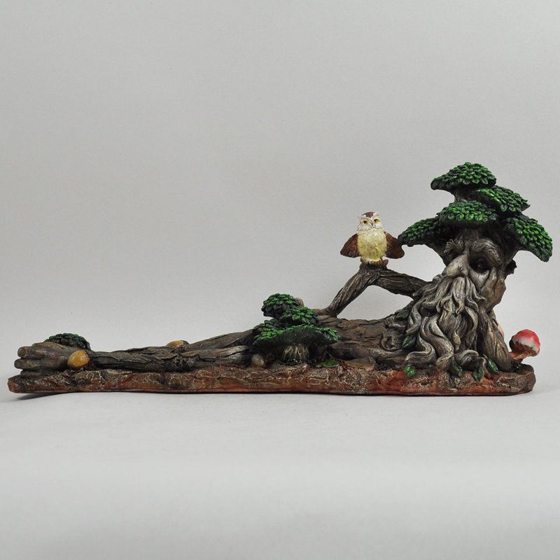 Laursen Lying Down with Owl Statue