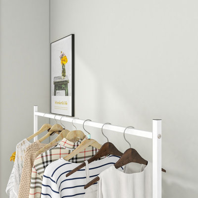 Sleek black garment rack | freestanding single-pole clothing hanger | multi-functional bedroom wardrobe organizer stand
