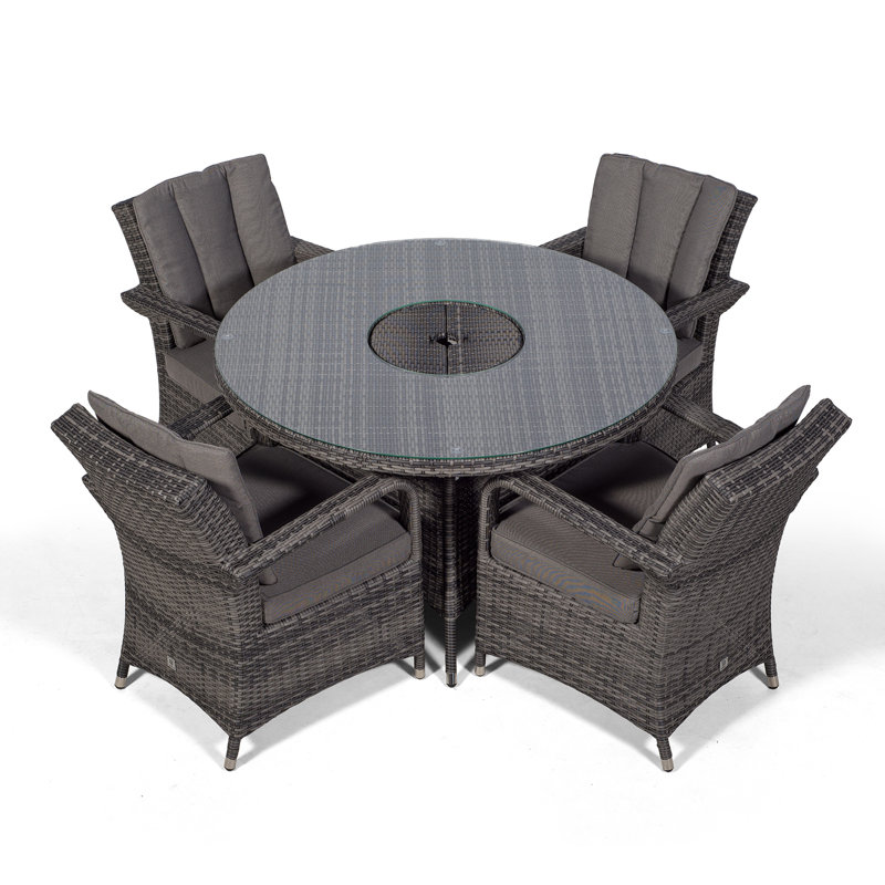 Karas 4 - Person Wicker Patio Dining Set with Round Table , Cushions Included, Grey