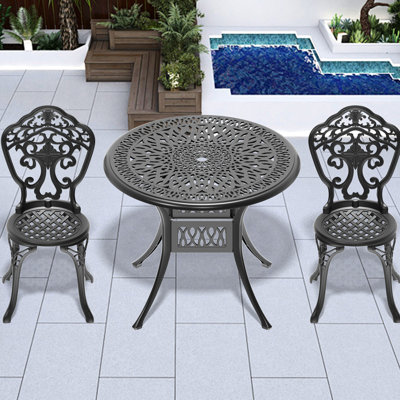 3 repas d'extérieur en fonte d'aluminium noir. Belles sculptures, construction fiable. Patin antidérapant thermolaqué. Il peut accueillir deux personnes confortablement toutes saisons, noir. Conception ergonomique élaborée. Vers les éléments.