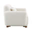 Fauteuil beige avec tissu et coussin décoratif attrayant