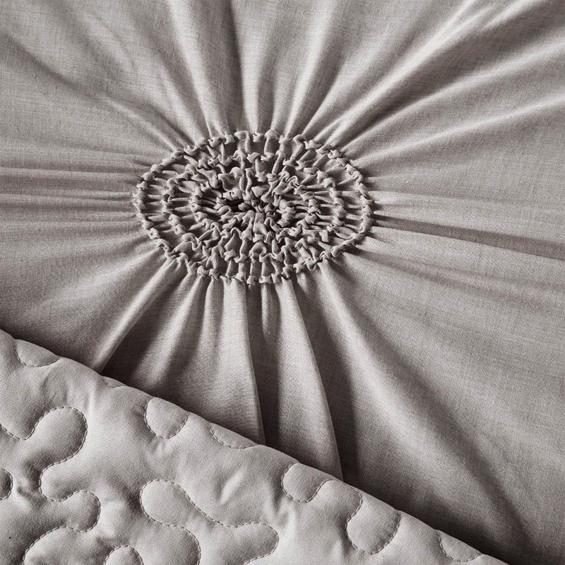 Housse pour lit de jour simple gris foncé avec motif à losanges et coussin en forme de minotaure