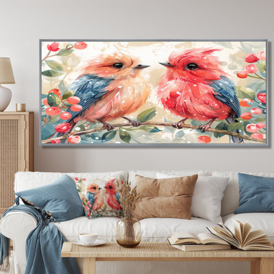 Inséparables roses et bleus sur une branche