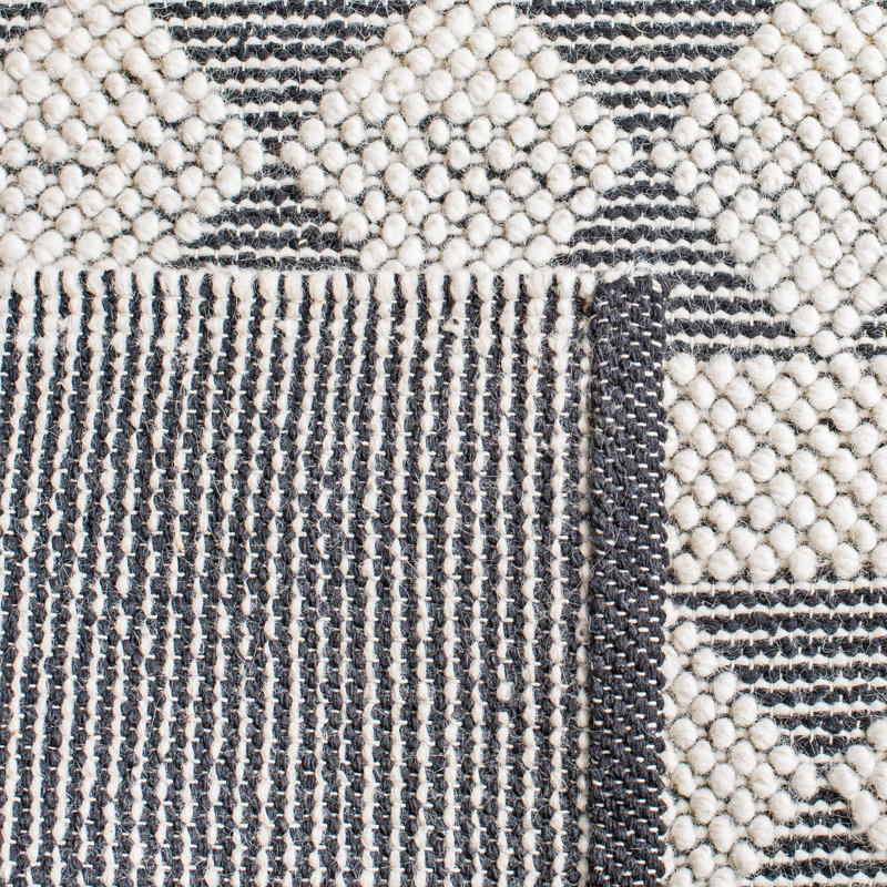 Handmade Black and Ivory Geometric Wool Area Rug