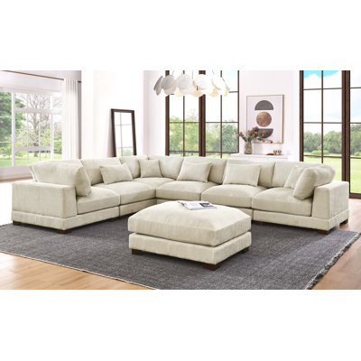Arliz 7 - Piece 144" Wide Reversible Modular Corner Sectional with Ottoman