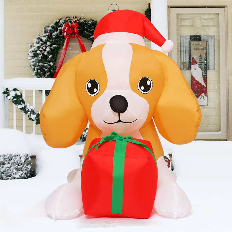 Chien gonflable de Noël illuminé 5 pi portant un chapeau de père Noël - Allongé avec les pattes avant sur la boîte-cadeau