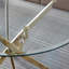 Table de salle à manger ronde contemporaine avec plateau en verre trempé transparent et pieds en acier inoxydable doré