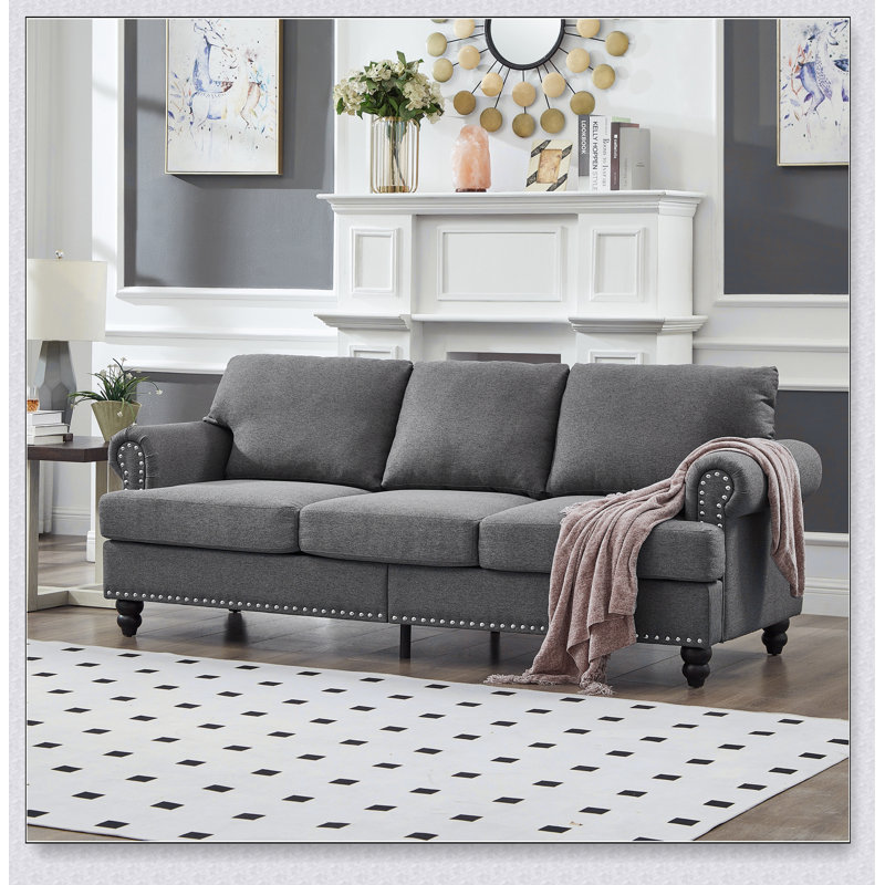Canapé 3 places au design moderne et classique avec clous, alliant confort et élégance pour un look intemporel., Gris