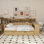 Lit de jour en bois avec tablettes de rangement, lit multifonctionnel avec lit gigogne et bureau d'étude