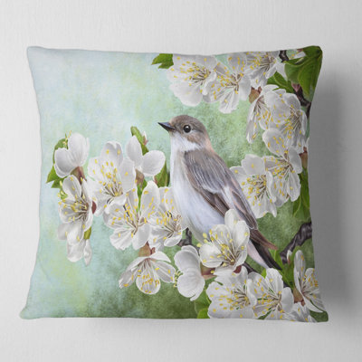 Housse et insert de coussin oiseau sur une branche d'arbre en fleurs