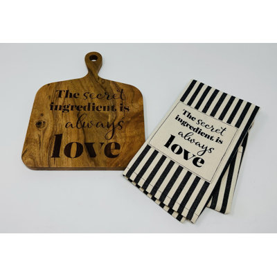 Planche à découper carrée avec serviette à thé rayée noire avec les mots «Secret Love Is Always Love»