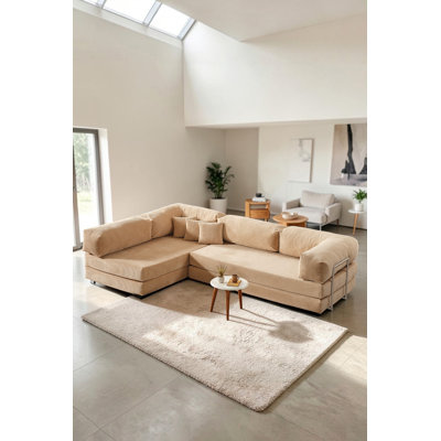 Canapé modulaire en L beige avec assise basse