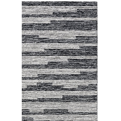 Tapis noir / ivoire en laine touffeté à la main Doralia