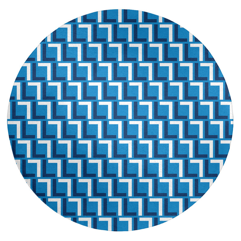 Tapis rond bleu à motif géométrique