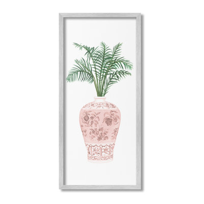 Palmier en feuilles dans un vase orné