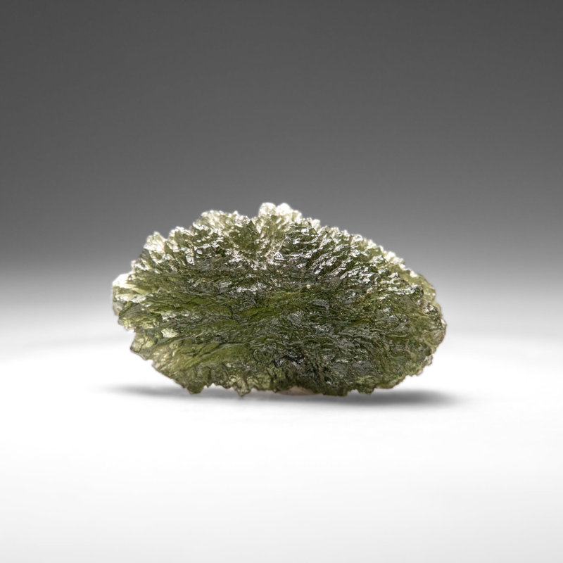 Genuine Moldavite Tektite (18.8 grams), 0.5" H x 1" W x 1.75" D