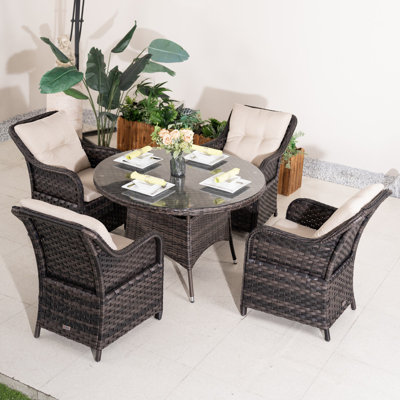 Ensemble repas pour 4 personnes en osier avec table ronde Guyer, coussins inclus