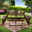 Ensemble repas pour 8 personnes avec 4 bancs intégrés et trou pour parasol Karabella-328028569