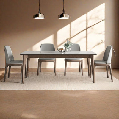Modern dining table and chair set with rock slab.