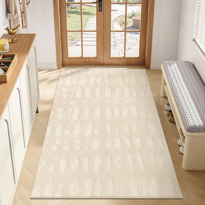 Tapis ivoire moderne en velours moelleux et moelleux