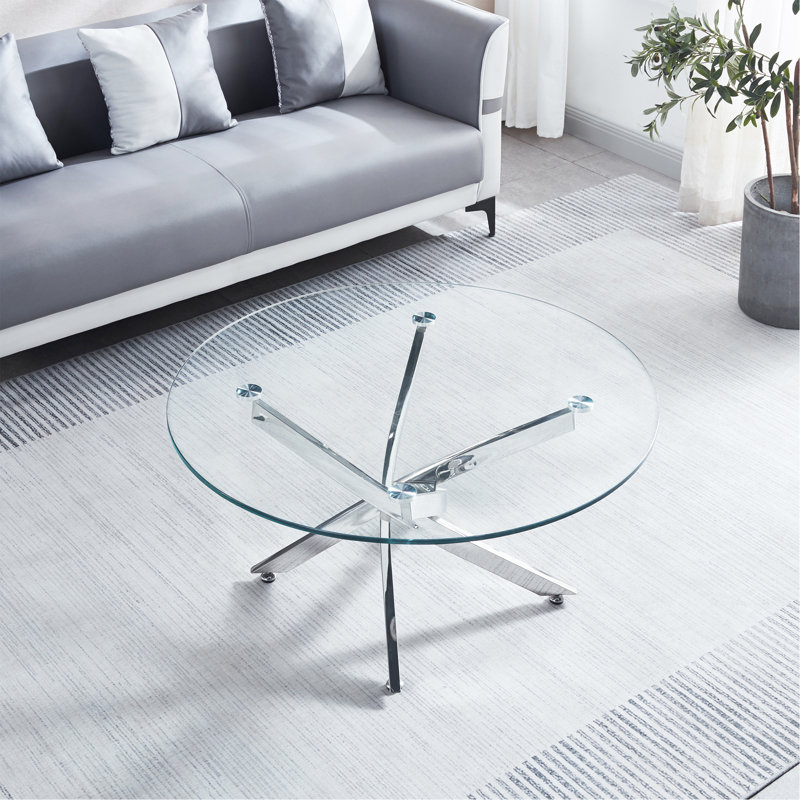 Table basse ronde moderne en verre trempé avec pieds chromés et base sculpturale