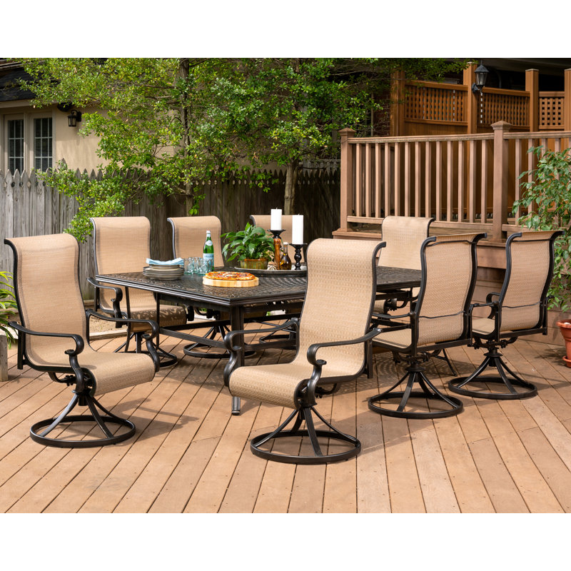 Sweeten 9 Piece Dining Set with 8 Swivel Rocker Chairs and 60 x 84 in. Table
