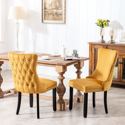 2 chaises de salle à manger rembourrées dorées, tissu en velours, pieds en bois massif, style Mid-Century, dossier haut, sièges confortables, chaises 2 pièces Sw8809gl en doré. Revêtement, mousse confortable, design élégant.