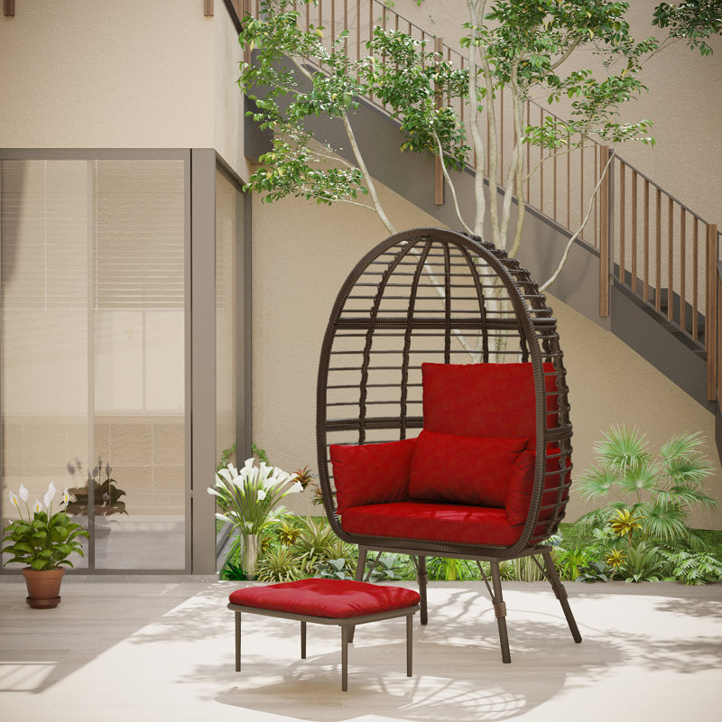 Fauteuil en osier avec repose-pieds Cherryle, Rouge