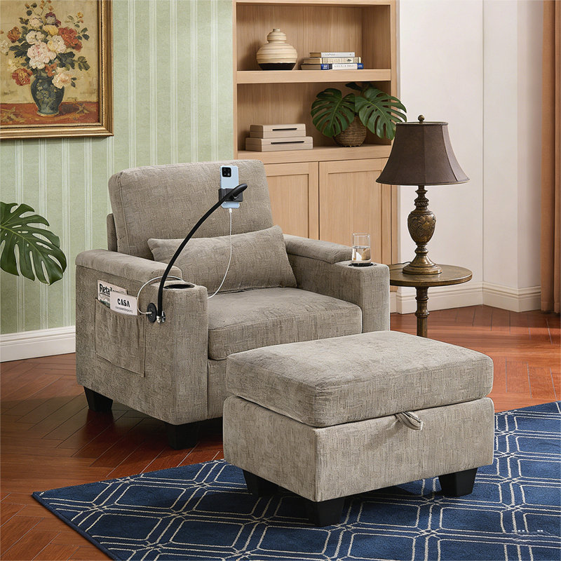 Single sofa recliner with manually adjustable backrest, USB charging port on the armrest side, and a matching storage ottoman