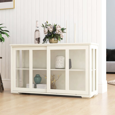 Support de cuisine avec porte en verre - blanc. Armoire intégrée pour le rangement. 2 portes coulissantes et tablette réglable. Extérieur peint. Dessous antidérapant pour maintenir l'armoire en place. Porte blanche. Stable