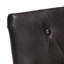 Fauteuil capitonné en cuir noir