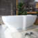 66.9'' x 29.5'' Freestanding Soaking Solid Surface Bathtub
