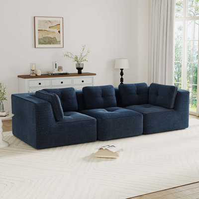 Canapé modulaire moderne Boneless avec assise profonde, revêtement en velours côtelé capitonné, conception sans assemblage, support ergonomique et base antidérapante pour le confort du salon.