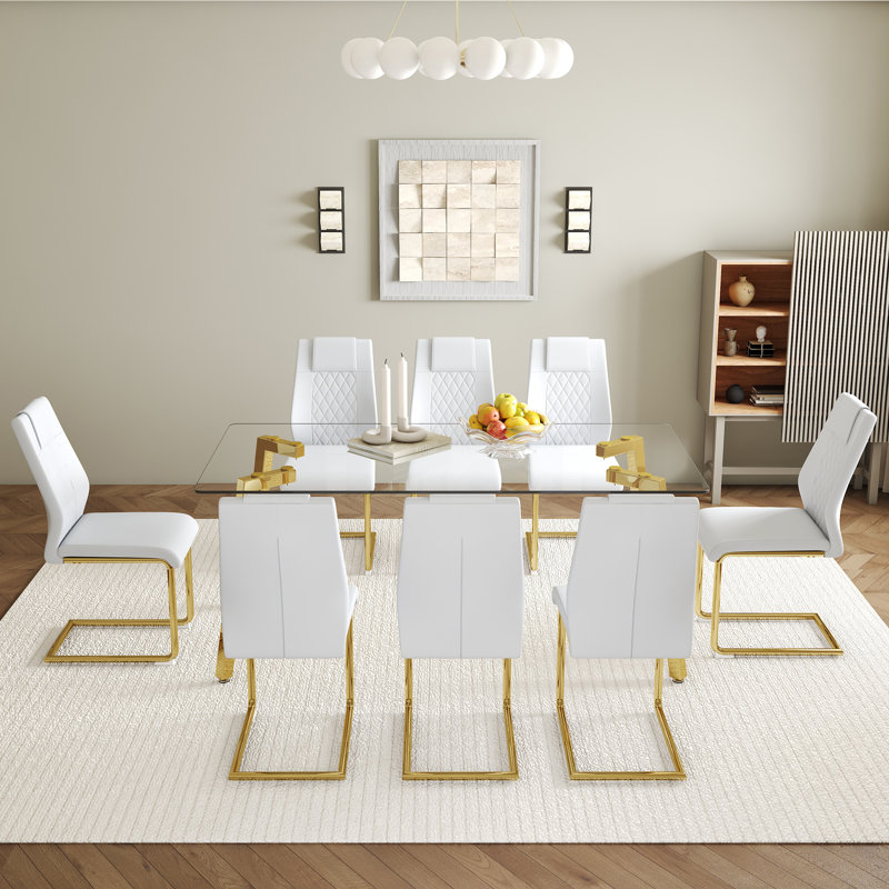 Ensemble de table de salle à manger moderne avec 8 chaises en polyuréthane blanc - table en verre 71 x 35,4 pouces, pieds élégants en métal doré
