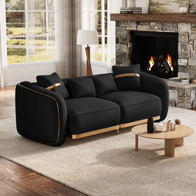 Canapé incurvé moderne avec assise profonde et accents dorés
