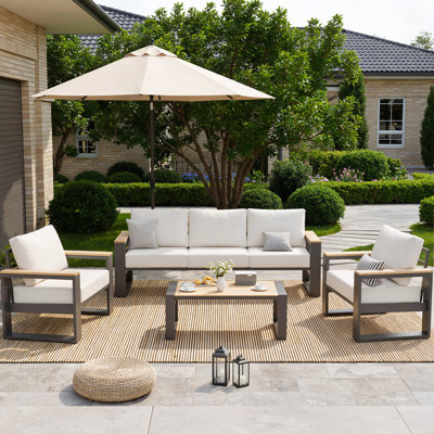 Ensemble de conversation extérieur 4 pièces, ensemble de mobilier de patio avec structure en aluminium comprenant un canapé 3 places, 2 fauteuils et une table basse, accoudoirs et plateau de table en plastique imitation bois, coussins ergonomiques de 12,7 cm d'épaisseur