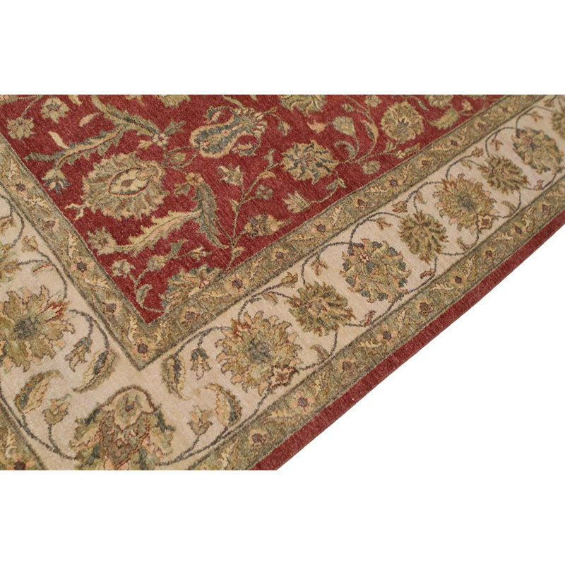 Tapis rouge / ivoire noué à la main