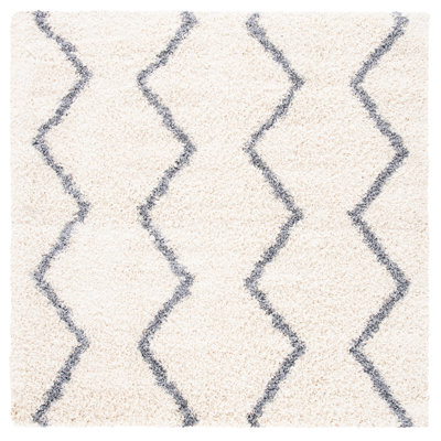 Tapis ivoire à motif géométrique