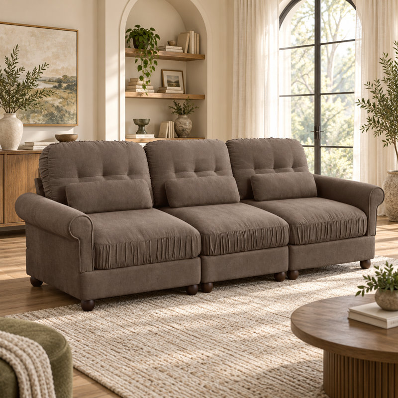 Canapé modulaire Rovesselle 3 places en chenille de 249 cm de large avec coussins à volants, accoudoirs arrondis et coussins lombaires
